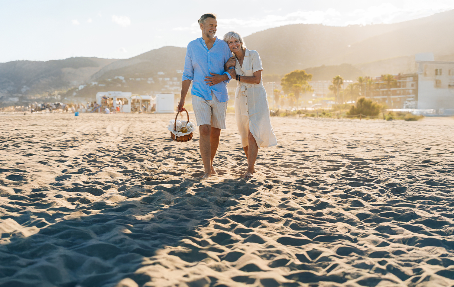 A couple walking along the beach