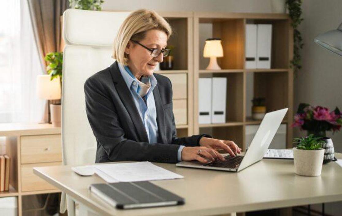 Woman Typing On Her Laptop