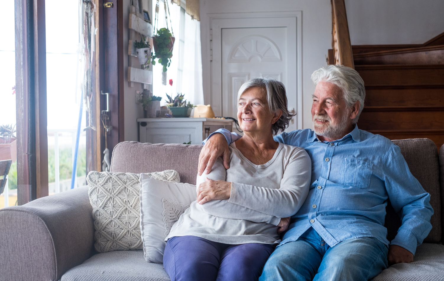 A senior couple having a conversation with an adviser