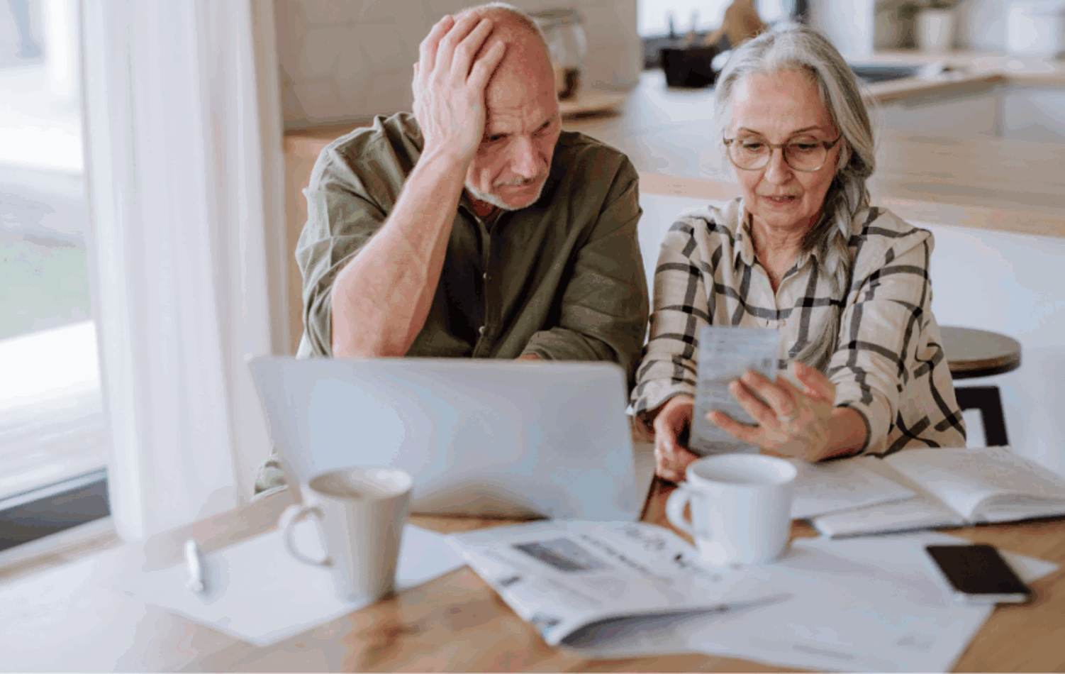 Senior man and woman reading