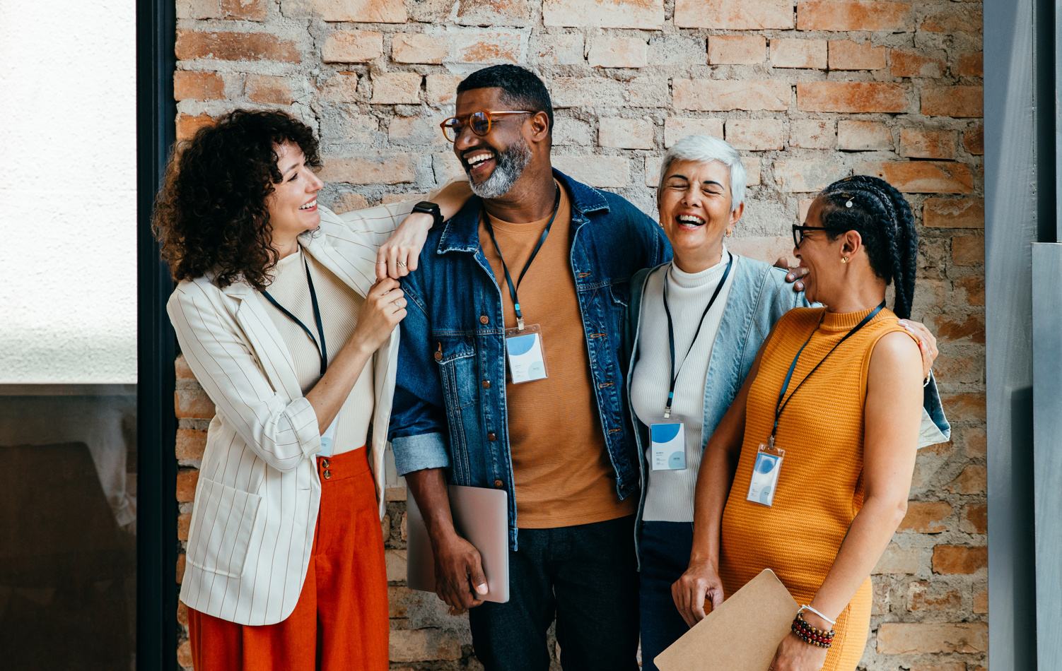 A group of workers laughing together