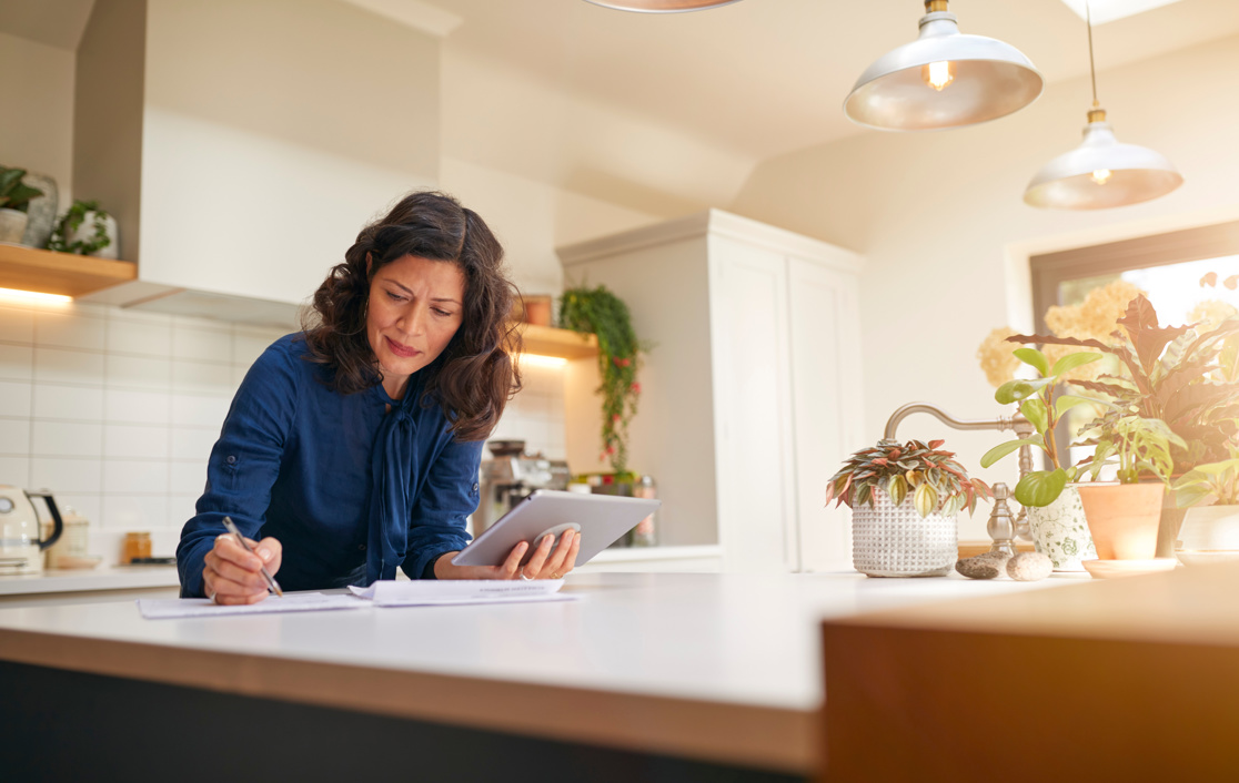 Two financial advisers sitting in front of a laptop