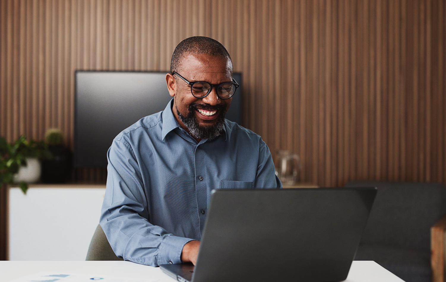 Man researching pensions on his laptop